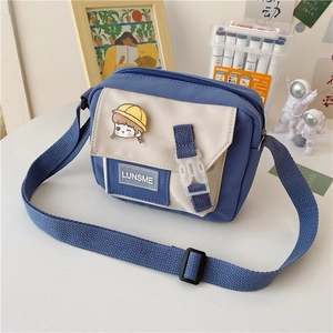 Detail of nylon square bag with cute cartoon badge and LUNSME label in campus setting