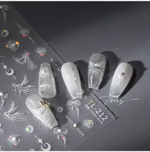 Close-up of TL-212 nail stickers with white ribbon, rose, and pearl chain designs