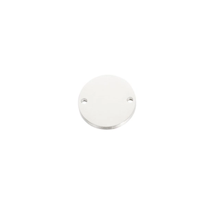 Close-up of a polished round stainless steel tag with dual holes for custom engraving