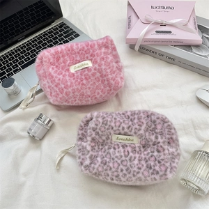 Plush leopard print makeup bags in pink and purple colors for cosmetic storage