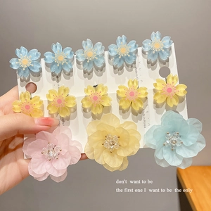 Cute macaron color cherry blossom hair clips in pastel blue, yellow, and pink flowers