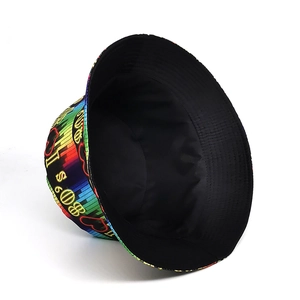 Reversible bucket hat with retro 80's music notes print and solid black styling