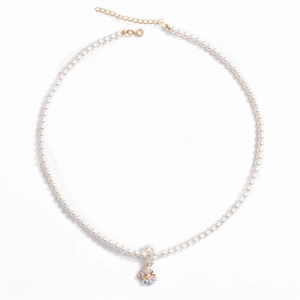 Elegant pearl necklace with a colorful gemstone butterfly pendant and adjustable gold clasp