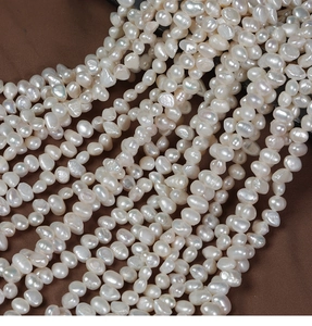 Macro shot of 6-7mm white baroque freshwater pearls for DIY jewelry making material