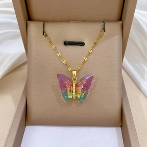Titanium butterfly necklace with gradient colors and gold foil in a jewelry gift box
