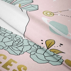 Close-up detail of soft pink tapestry fabric with mint floral and planetary patterns