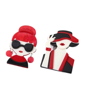 Set of two creative acrylic brooches featuring stylish cartoon girls in red and black