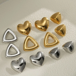 Polished hollow heart and triangle earrings in gold and silver finish on stone