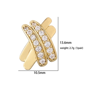 Detail view of gold crisscross earrings with cubic zirconia, size 13.6mm x 10.5mm