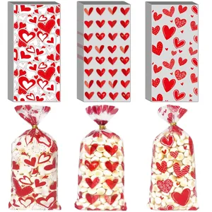 Detail of red and white heart pattern gift bags with golden twist ties for Valentine candy