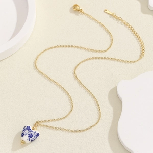 Vintage heart-shaped blue and white porcelain necklace with 18K gold plated chain
