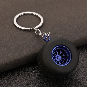 PVC car tire keychain featuring a realistic blue wheel hub and black rubber tire model