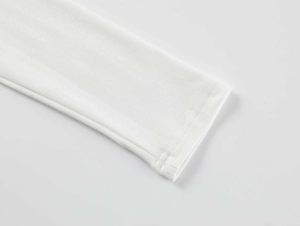 Close-up of white modal athletic t-shirt cuff showing high-quality stitching and fabric texture