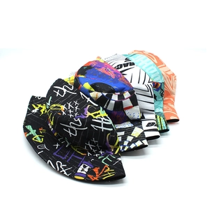 Close-up of vibrant graffiti print and abstract art patterns on various bucket hats