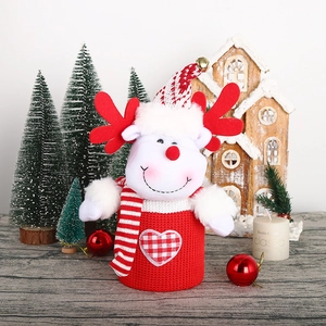 Christmas knitted reindeer wine bottle cover with red antlers and festive hat decoration