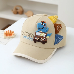 Detail of cotton baseball cap with 3D silicone dinosaur and car patterns on beige canvas