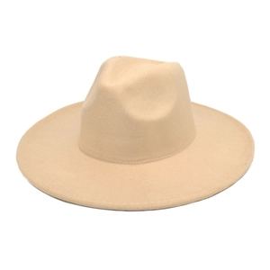 Flat lay of a beige wide-brim fedora hat with a classic heart-shaped top crease