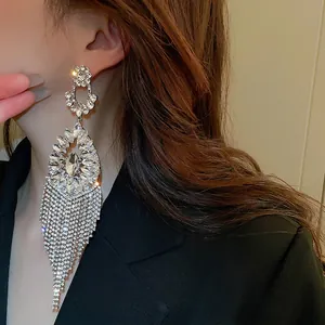Elegant long fringe tassel drop earrings with sparkling crystals and silver floral studs