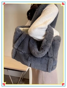 Detail of a dark gray plush faux fur tote bag with stylish diamond quilted pattern