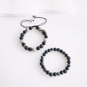 Adjustable men's volcanic stone beaded bracelets in black and grey natural stone patterns