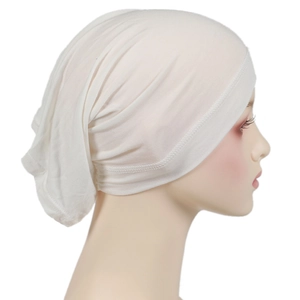 Detail view of cream modal hijab inner cap with elastic stitching on a mannequin head