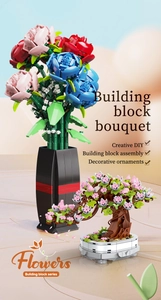 Close-up of creative DIY building block flower bouquet with cherry blossom bonsai and vase
