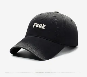 Close-up of distressed details and white FBQE embroidery on black vintage baseball cap