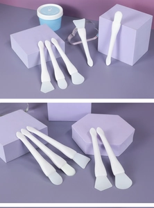 Dual-head silicone face mask brush with ergonomic handle and soft synthetic bristles