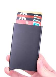 Detail of black aluminum RFID card holder with automatic pop-up lever mechanism