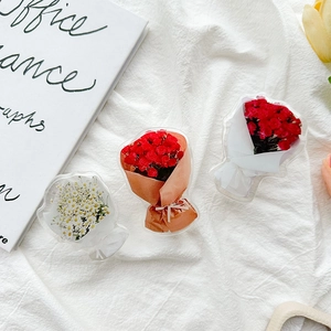 Detail shot of 3D acrylic flower bouquet phone grips with red roses and white petals