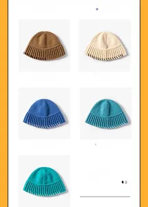 Close-up of knit bucket hats in diverse colors with contrast stitching details