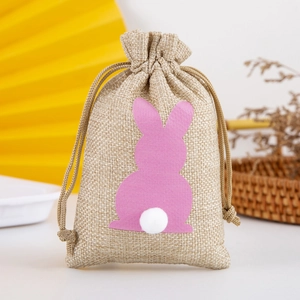 Linen drawstring gift bag with pink rabbit silhouette and white pom-pom detail