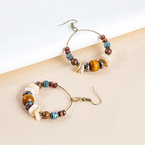 Bohemian beaded hoop earrings with turquoise and wood accents in antique bronze finish