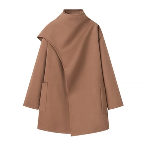 Detail of asymmetric wide lapel and soft wool texture on brown long-sleeved coat