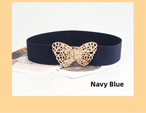 Detail of navy elastic belt featuring an intricate gold hollow butterfly metal buckle