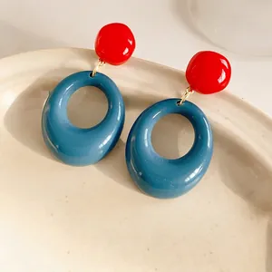 Retro geometric resin earrings with bold red stud and Klein blue oval pendant for women