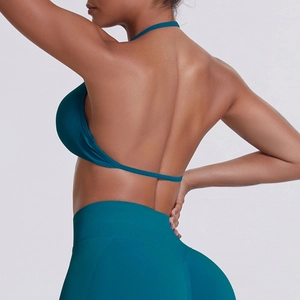 Detail of seamless dark teal sports bra back and high-waisted ribbed leggings set