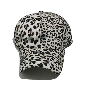 Macro shot of baseball cap featuring gradient leopard print and six-panel stitching detail