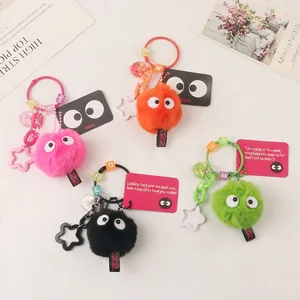 Colorful fluffy pom-pom keychains with cute eyes and assorted star charms and letter beads