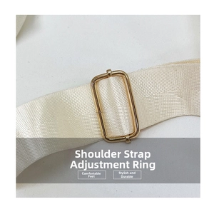 Macro shot of off-white woven strap with premium gold adjustable metal buckle detail