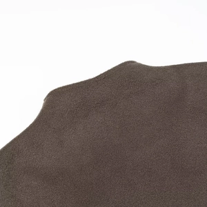 Close-up of brown suede fabric texture with high-quality matte finish for jackets