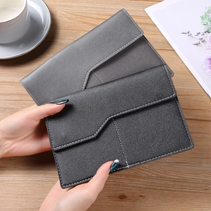 Close-up of grey PU leather sun visor organizer with white stitching details