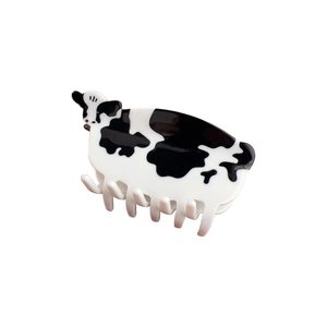 Cute cow pattern hair claw clip with black and white spots in polished acetate finish