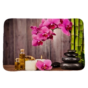 Alfombra de baño zen absorbente con orquídeas rosas, bambú y piedras de basalto