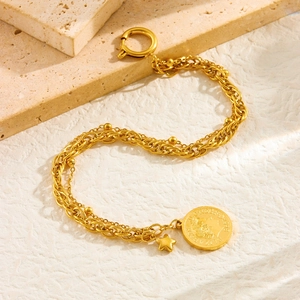 Vintage gold layered stainless steel bracelet with Elizabeth II coin and star pendants