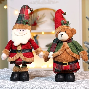 Close-up of Santa and bear plush toys with knitted textures for Christmas decoration