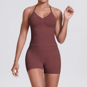 Detail view of the deep brown ribbed waistband and high-stretch fabric of yoga shorts