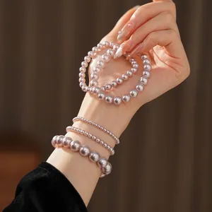 Elegant purple pearl beaded bracelet set with multiple sizes of lustrous round pearls