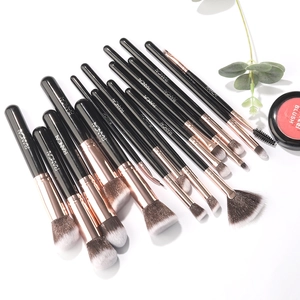 Detail of 15-piece makeup brush set with rose gold ferrules and soft gradient bristles