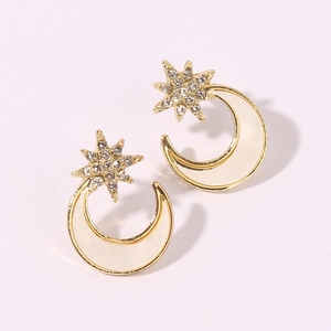 Fashionable gold star and moon stud earrings featuring sparkling white rhinestones